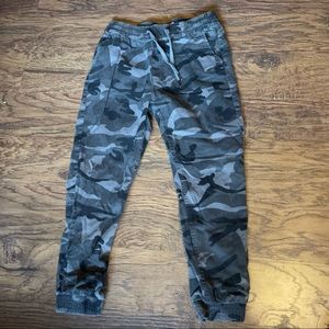 Black and grey camo joggers with elastic waistband and drawstrings